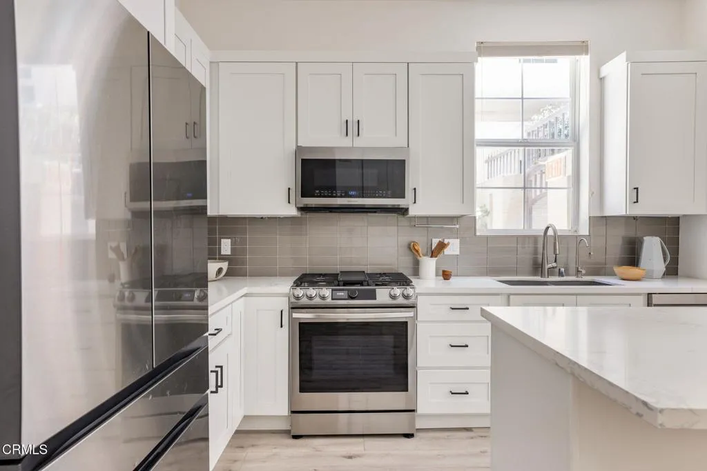 026_Pacific Promenade 13020 Unit 102_by