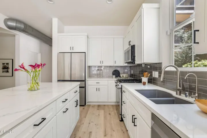 018_Pacific Promenade 13020 Unit 102_by