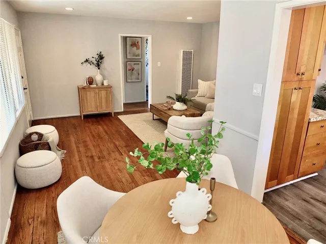 Open view from dining room into the kitchen and lovely living room