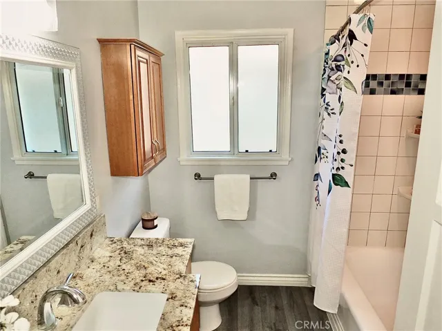 Another view of this light and bright remodeled bathroom