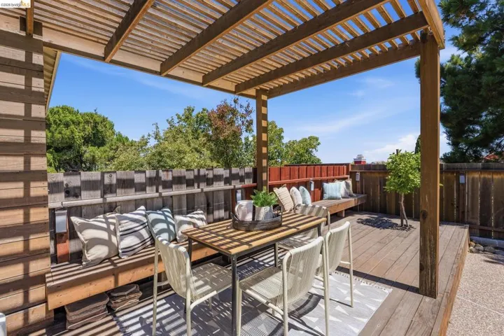 Outdoor wood-finish deck with an integrated pergola structure