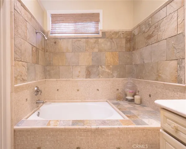 Remodeled Bathrooms with Custom Tile and Fixtures