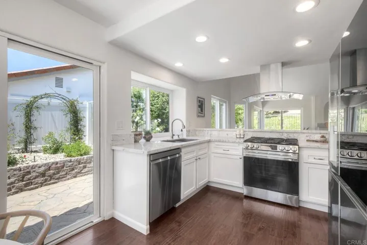Light-filled kitchen, updated cabinetry, new dishwasher, new range hood