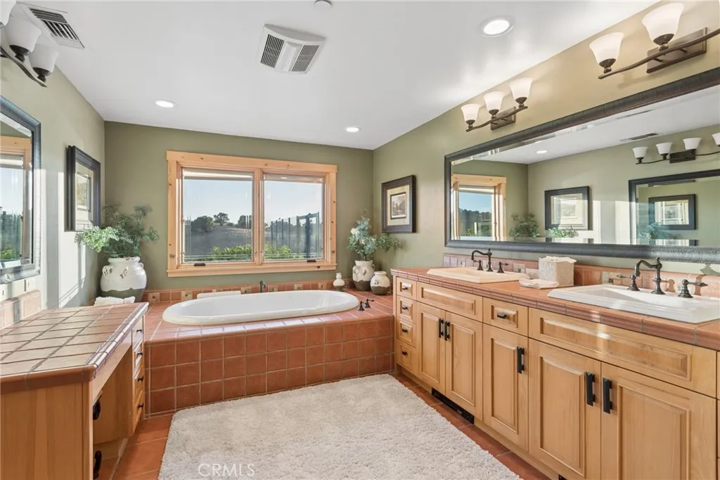 primary bathroom soaking tub and double vanities