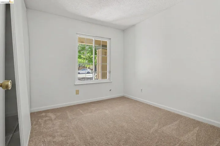 Room featuring light-toned carpeting and white walls