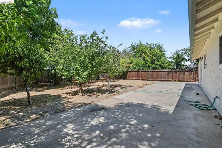 Expansive outdoor patio area featuring a concrete surface