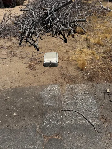 Water Meter for the Home Next Door located near the Front Left Corner of the Lot. Check with the City/County for availability and access.