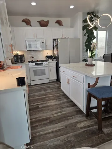 Kitchen with custom built island cooper sink, finishes