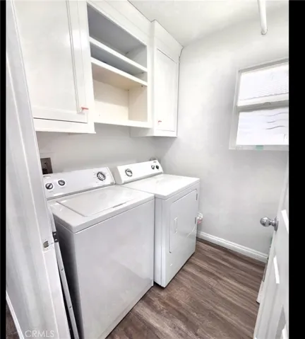 Laundry room with built in cabinets.