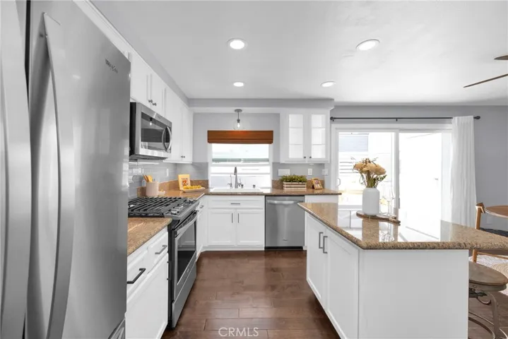 Fully upgraded kitchen, including newer appliances and a serving window.
