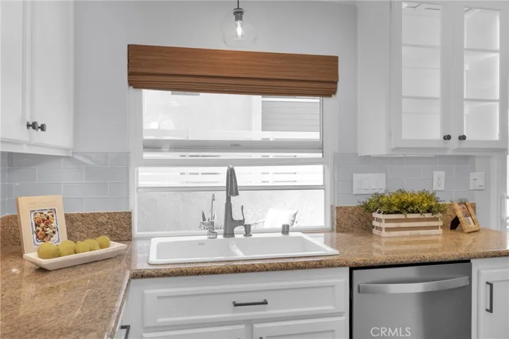 An entertainer's dream with a serving window out to back patio.
