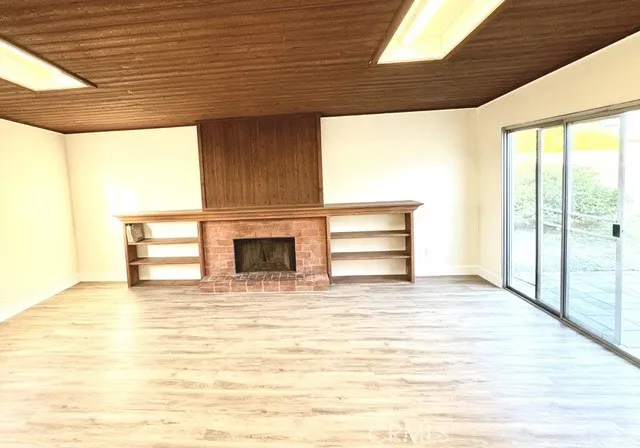 Den with fireplace.