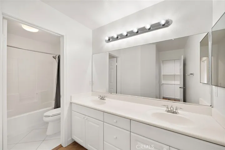 Upstairs secondary bathroom with double sink vanity