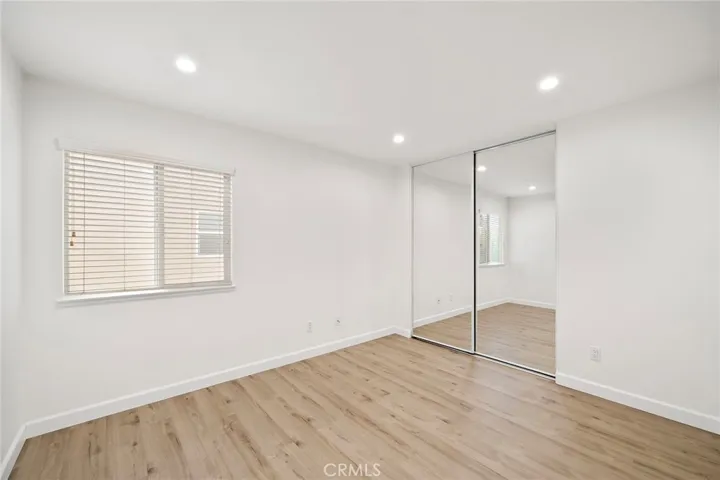 Bedroom 2 with mirrored closet door