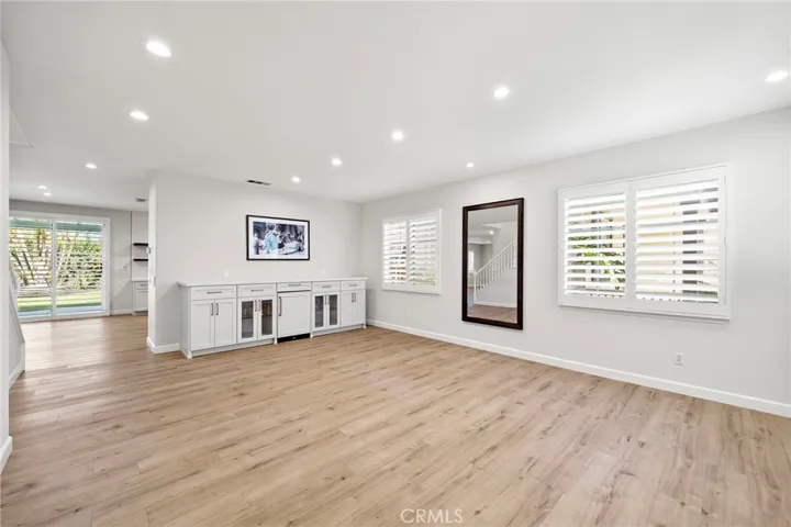 Dining room and living room with custom built-in with wine refrigerator