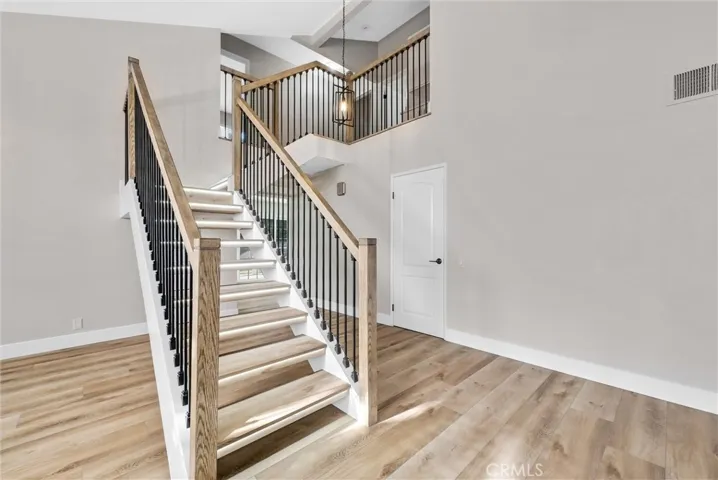 Elegantly designed staircase featuring integrated accent lighting.