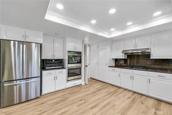 Large kitchen with stainless appliances