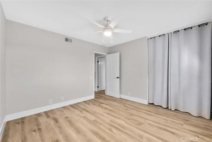 Secondary bedroom with ample natural light and spacious closet. (middle bedroom)