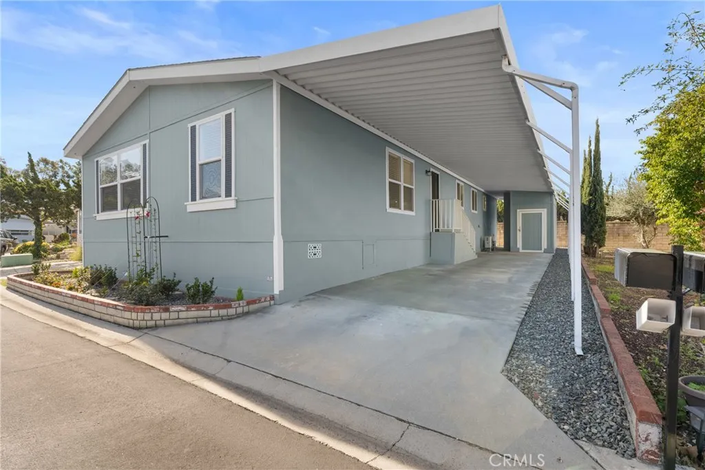 Carport with storage shed