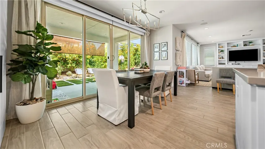 large sliding glass doors extend your living space to the outdoor covered patio