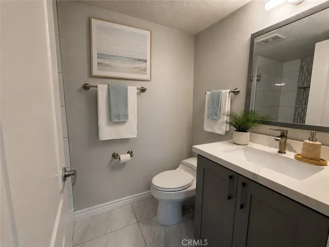 Downstairs 3/4 Guest Bathroom #3 w/shower.  Digitally staged photo