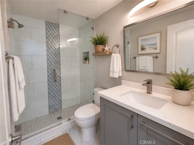 Upstairs guest 3/4 bathroom #2.  Digitally staged photo