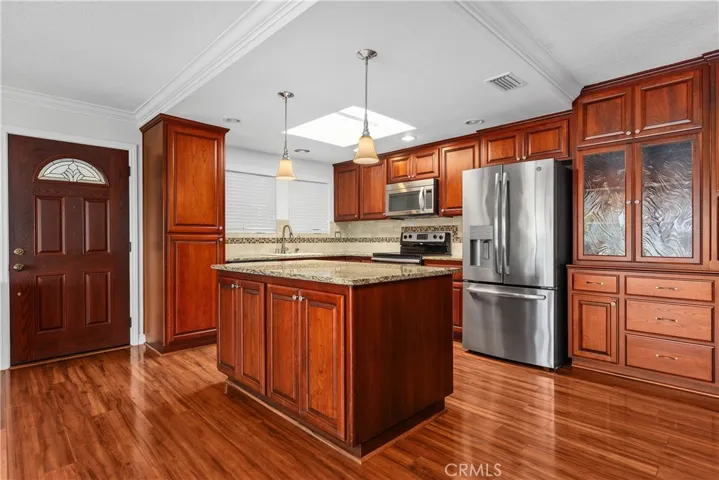 Built in storage cabinets adjacent to the kitchen.