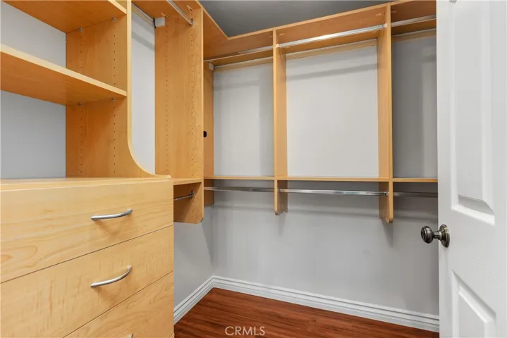 Well designed walk-in closet.