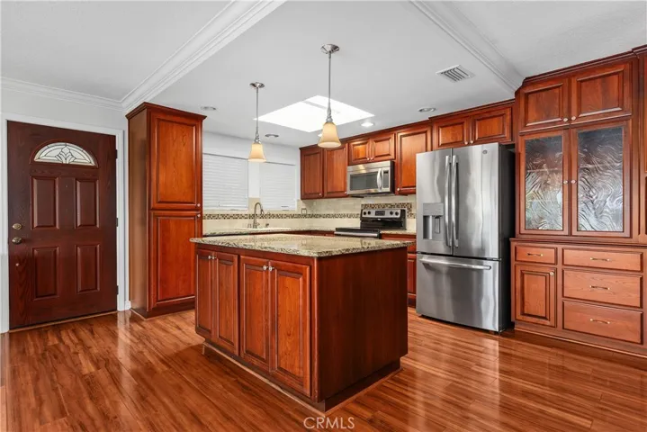 Built in storage cabinets adjacent to the kitchen.