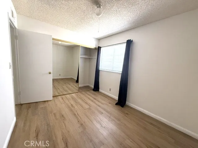 Second bedroom with double mirror closet door