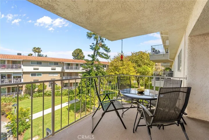 Covered balcony overlooking the landscaped community grounds