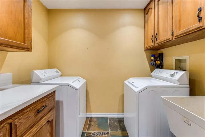 Laundry room with storage located just off the kitchen