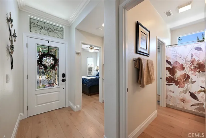 Front door, guest bathroom and guest bedroom