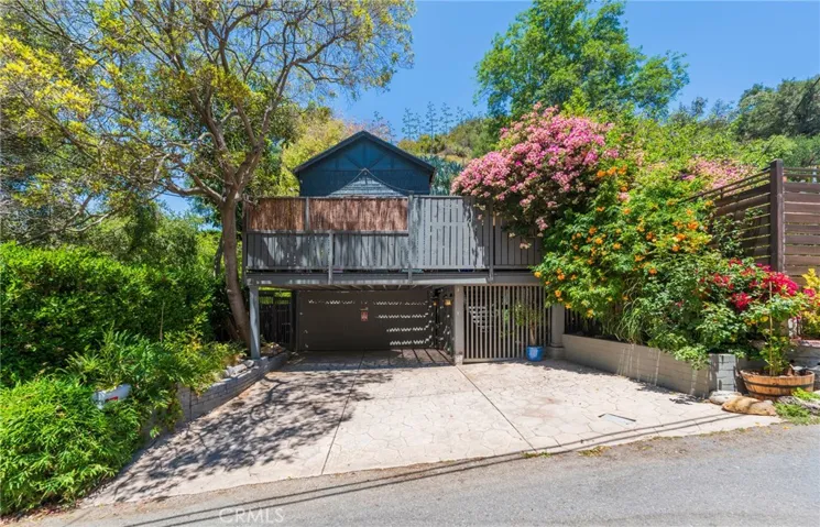 A thoughtfully restored 1928 residence tucked within one of Benedict Canyon's most sought-after and historically significant streets.