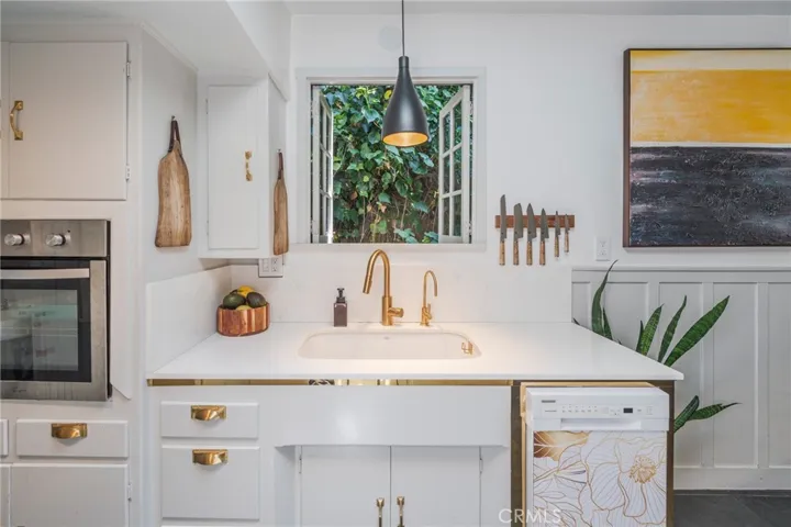 Custom details throughout the kitchen honor the home's history while supporting everyday functionality.