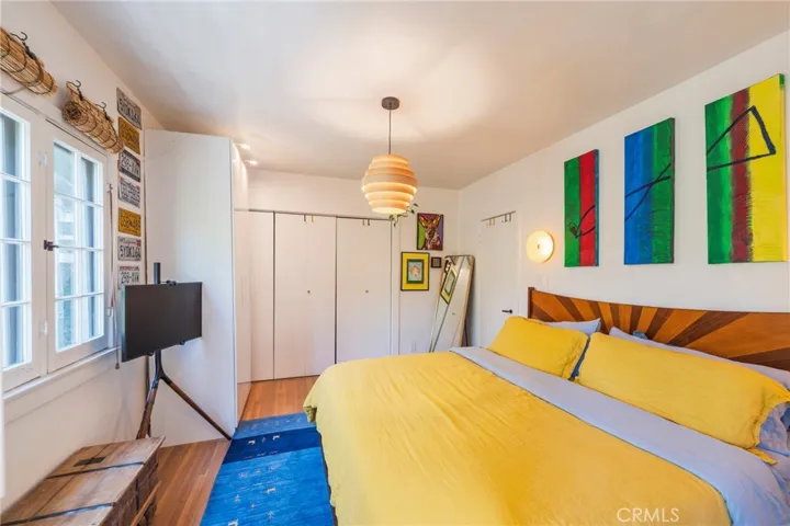 The primary bedroom offers privacy, natural light, and canyon views.