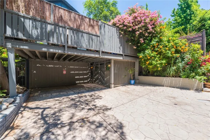 A rare amenity in Benedict Canyon, the property offers an enclosed garage and parking for up to three vehicles.