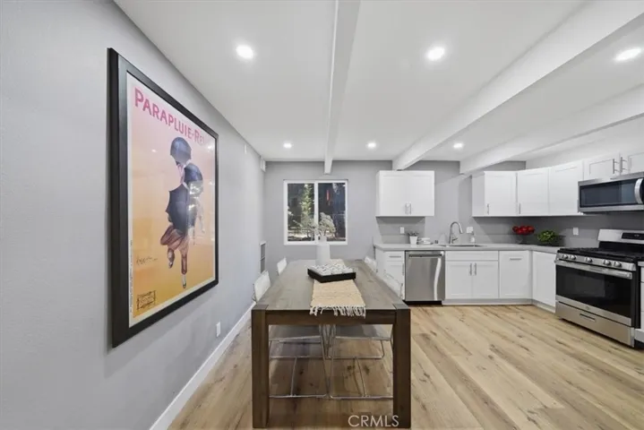 Upgraded kitchen with newer cabinets, stainless steel appliances and quartz counter tops