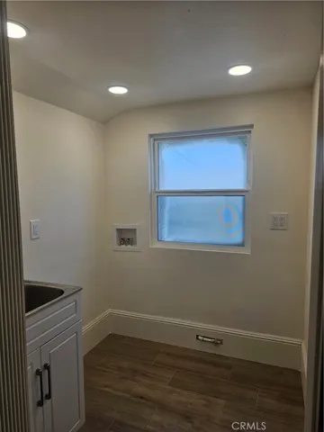 LAUNDRY ROOM WITH LAUNDRY SINK AND WASHER AND DRYER HOOKUPS