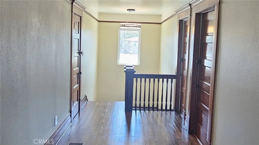 BEAUTIFUL CLASSY CHANDELIER ADORNS THE STAIRWAY