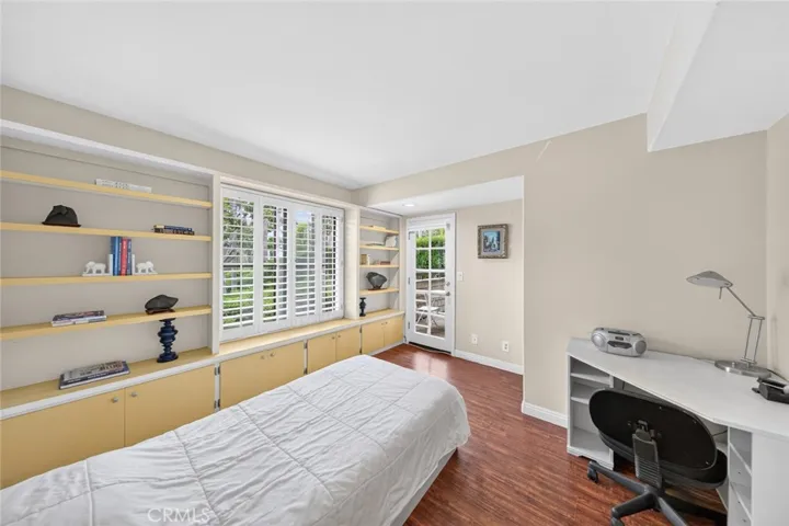 Second suite featuring French doors that lead to a private deck