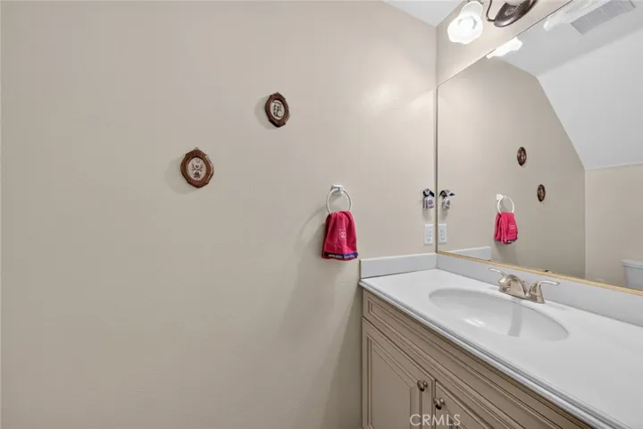 Convenient powder room located next to the laundry room