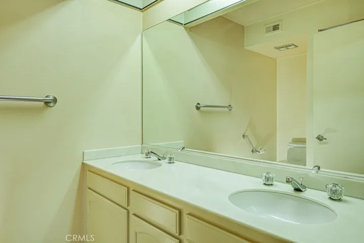 Primary bathroom has dual sinks.
.
