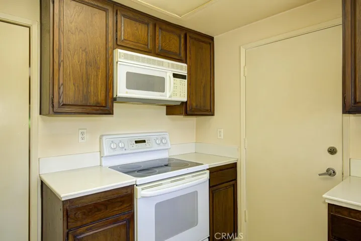 Another view of the kitchen. Service door at right provides direct access to the one-car garage.