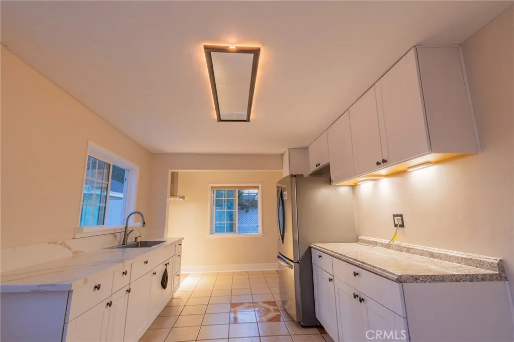 Kitchen ceiling night light feature. Cabinet lights are battery operated.