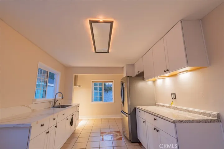 Kitchen ceiling night light feature. Cabinet lights are battery operated.