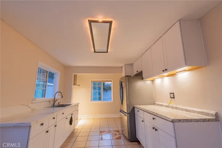 Kitchen ceiling night light feature. Cabinet lights are battery operated.