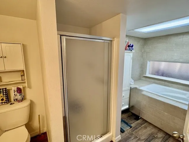 One large bathroom with deep soak jetted tub.