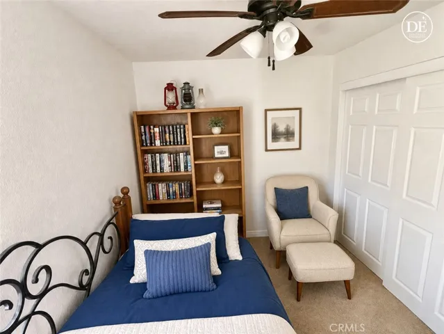 Enhanced photo of 3 rd bedroom to show space keeping size, removing clutter