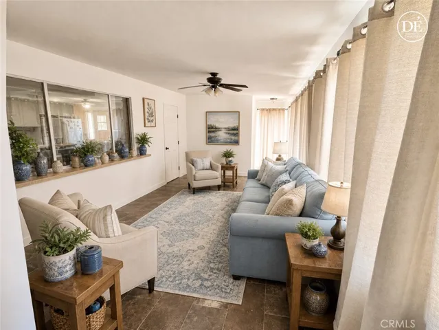 Enhanced photo of fully enclosed extra patio room showing living space, after removing clutter